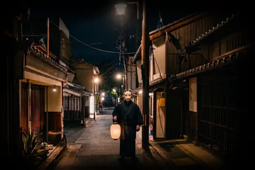 Things to do In Nara Japan Ghost Tour Guide holding japanese lantern