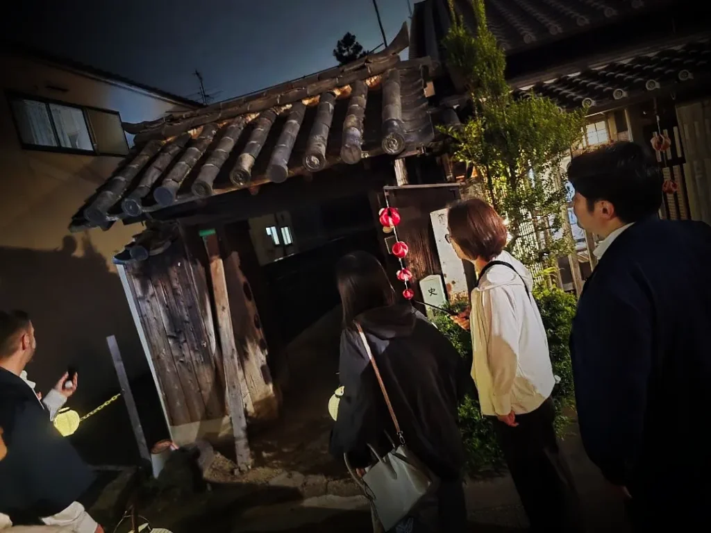 Participant of the Nara Ghost Walk discover a huge old gate